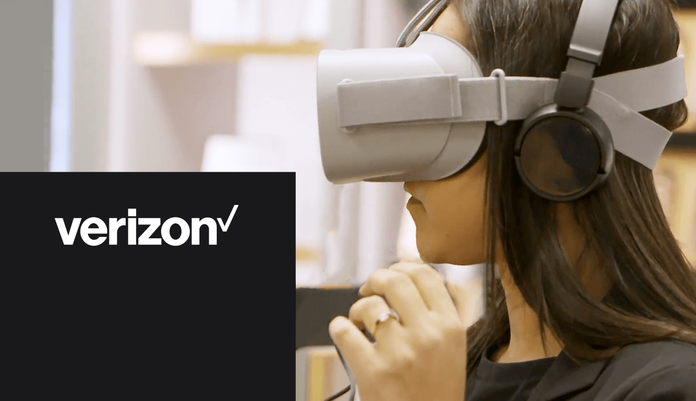 Verizon logo with a brown-haired woman wearing a VR headset
