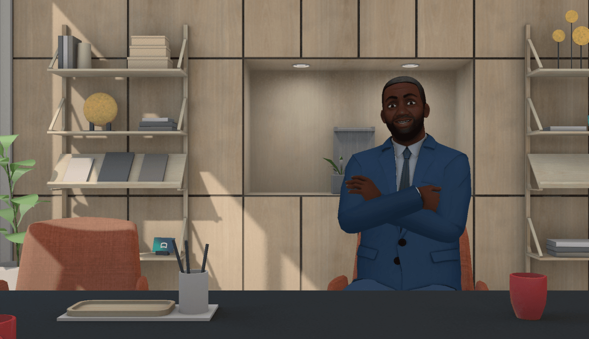 Screen grab of Strivr VR image - African-American male in a blue suit sitting opposite the screen